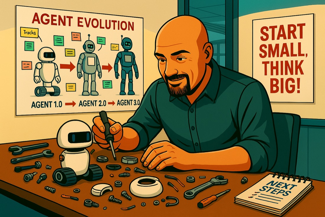 A man at a workbench assembling small robots, under a poster reading "Start small, think big".